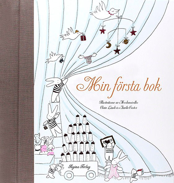 Min första bok bebis med omslag på illustrare kaniner och fåglar i minimalistisk design.