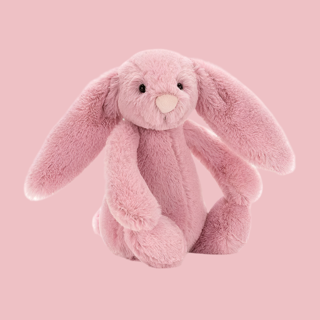 En söt liten kanin att krama när man vill sova bättre. Rosa bakgrund och rosa kaning