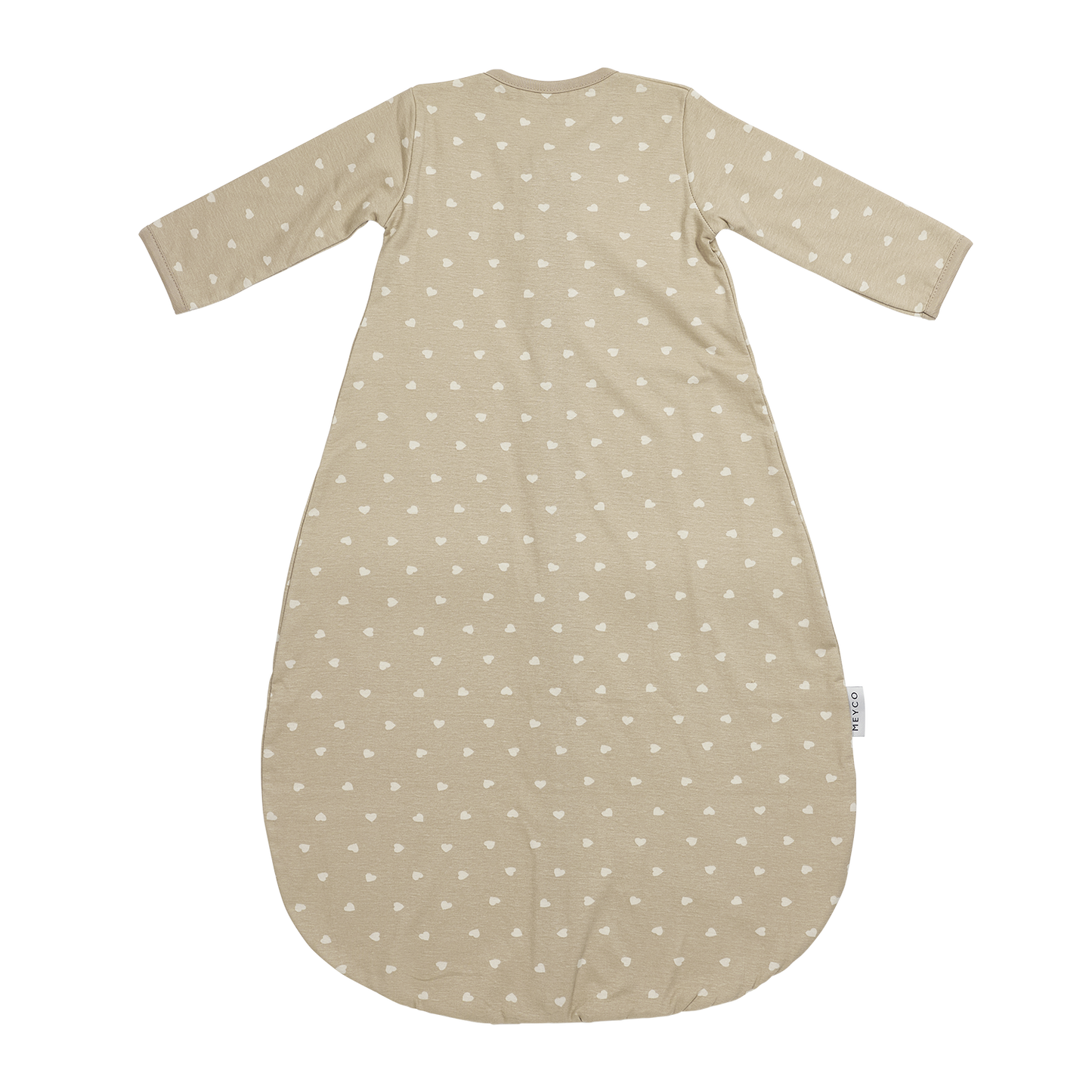 Närbild på beige sovpåsemed vita små hjärtan som håller barnet varmt och tryggt hela natten