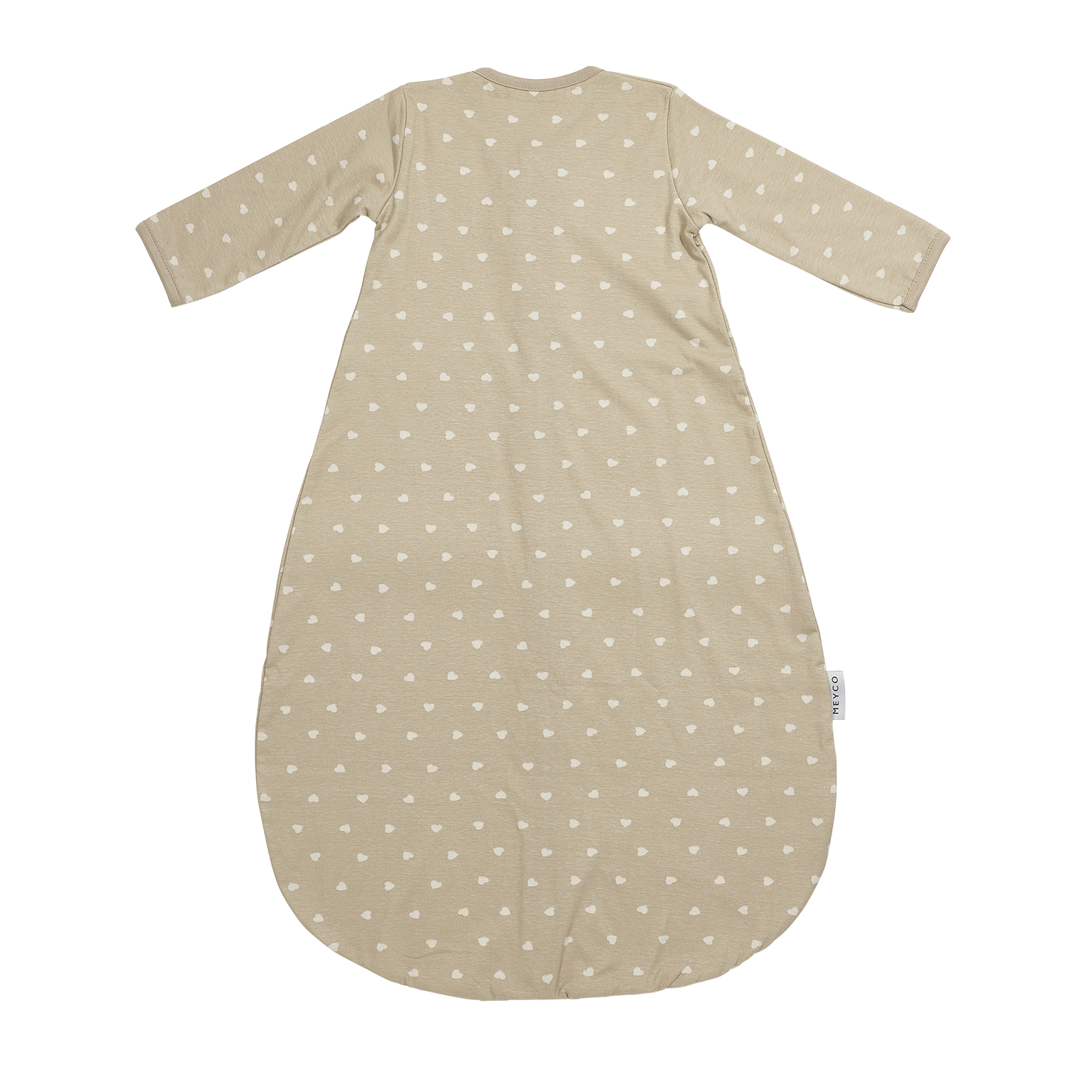Närbild på beige sovpåsemed vita små hjärtan som håller barnet varmt och tryggt hela natten